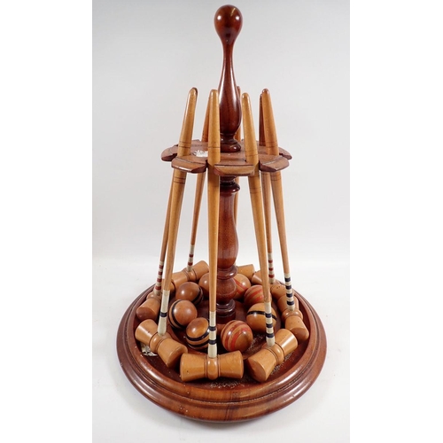 1019 - A Victorian table croquet set on turned mahogany  stand with mallets, balls, clamps and hoops