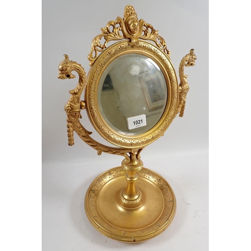 1021 - A fine 19th century continental ormolu circular mirror on stand cast mask and dragons heads amongst ... 