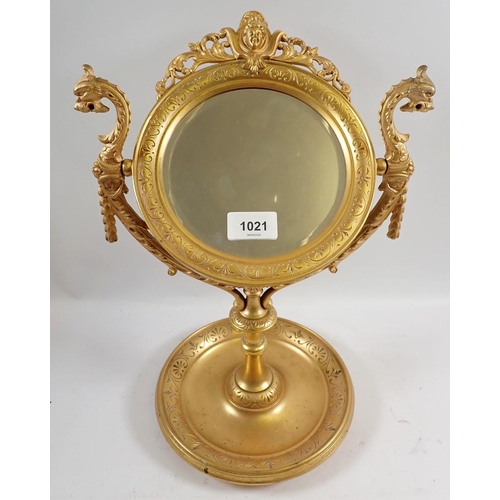 1021 - A fine 19th century continental ormolu circular mirror on stand cast mask and dragons heads amongst ... 