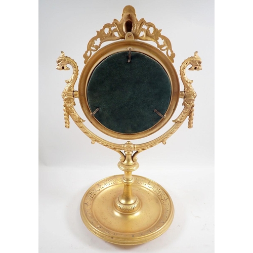 1021 - A fine 19th century continental ormolu circular mirror on stand cast mask and dragons heads amongst ... 