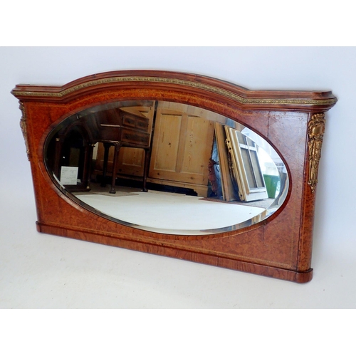 1023 - A French style inlaid walnut and gilt overmantel mirror with broken arch top, the oval plate with he... 