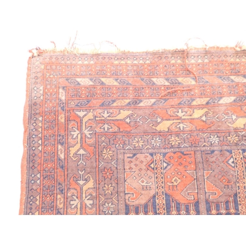 1031 - An unusual antique Turkoman rug with small geometric panels within multiple floral and geometric bor... 