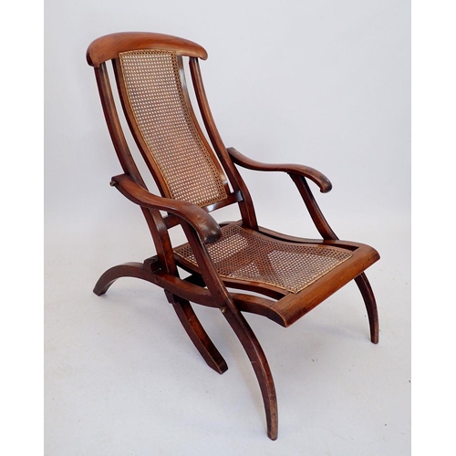 1035 - A Victorian mahogany framed folding campaign or garden chair with cane seat and back