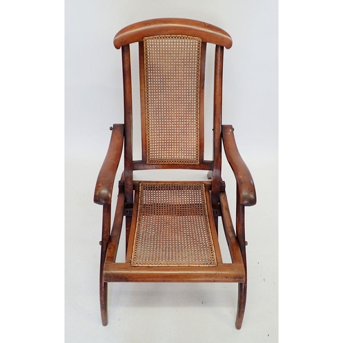 1035 - A Victorian mahogany framed folding campaign or garden chair with cane seat and back