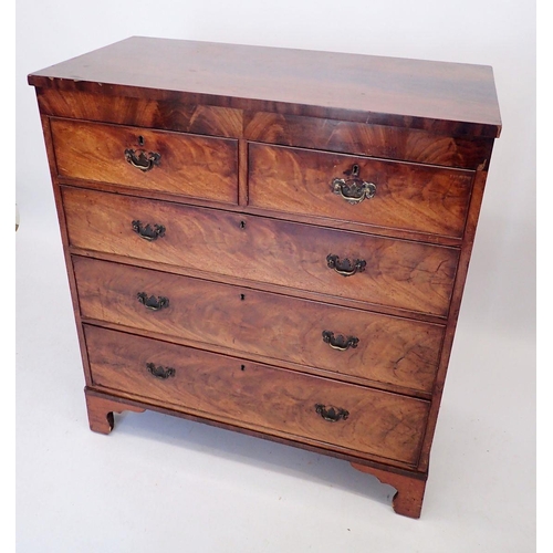 1038 - A Georgian mahogany chest of two short and three long drawers with brass drop handles on bracket fee... 