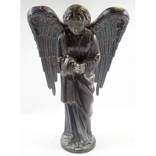 1040 - A 19th century bronze model of a winged angel on circular base, 38cm high