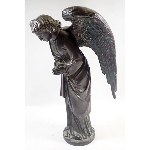 1040 - A 19th century bronze model of a winged angel on circular base, 38cm high