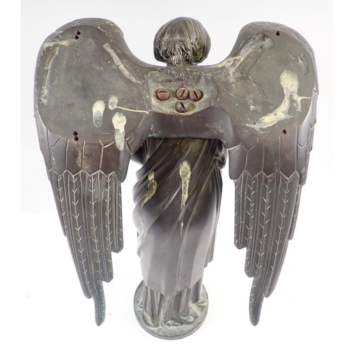 1040 - A 19th century bronze model of a winged angel on circular base, 38cm high