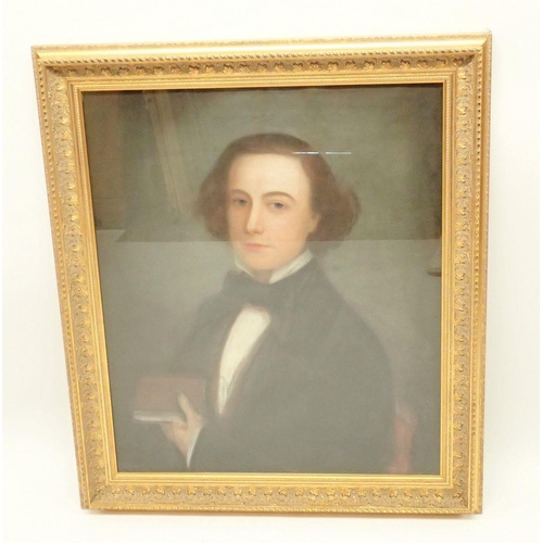 1044 - A 19th century pastel portrait of young gentleman holding a book, 75 x 61cm in gilt frame