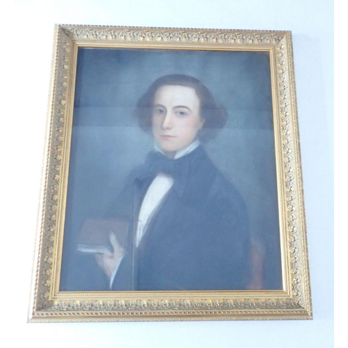 1044 - A 19th century pastel portrait of young gentleman holding a book, 75 x 61cm in gilt frame