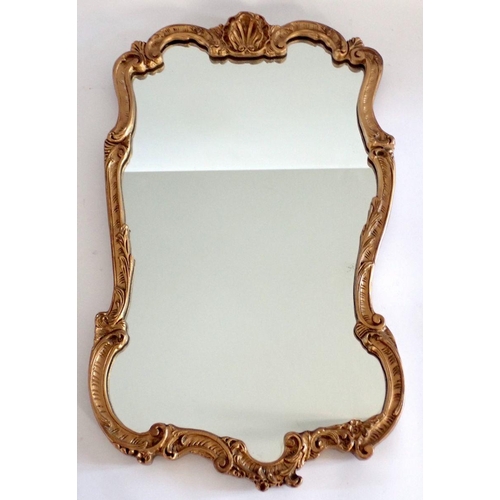 1046 - A gilt wall mirror with shell pediment, 61 x 37cm