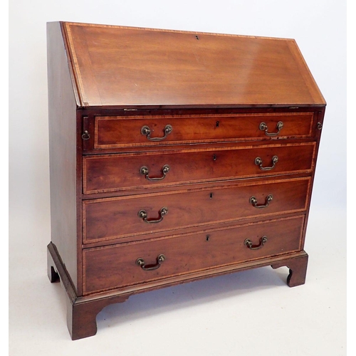 1047 - A Georgian style mahogany bureau, the slope front enclosing fitted interior with drawers, central cu... 