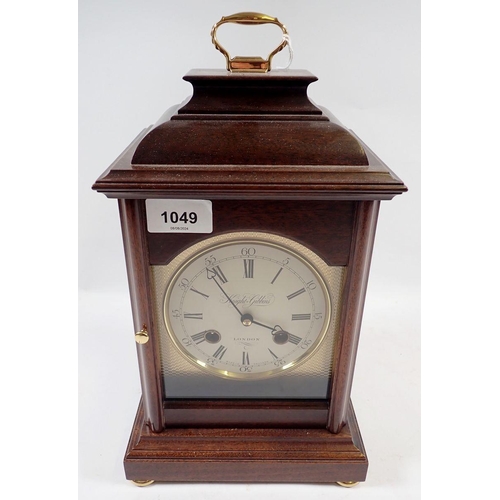 1049 - A Knight Gibbins mahogany cased bracket style mantel clock, 32cm tall