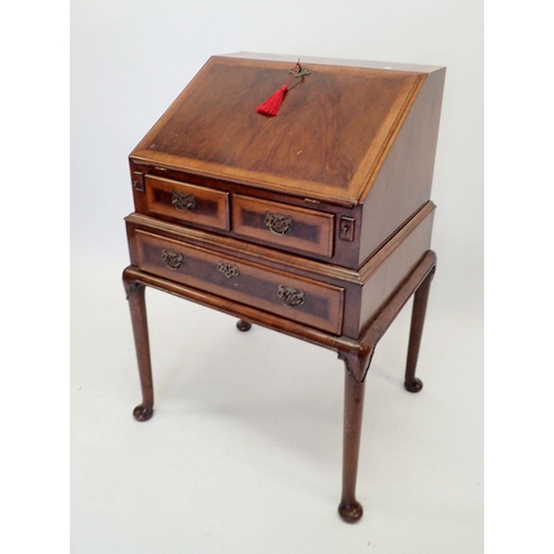 1051 - A Queen Anne style mahogany bureau with two frieze drawers over long drawer all on cabriole supports... 