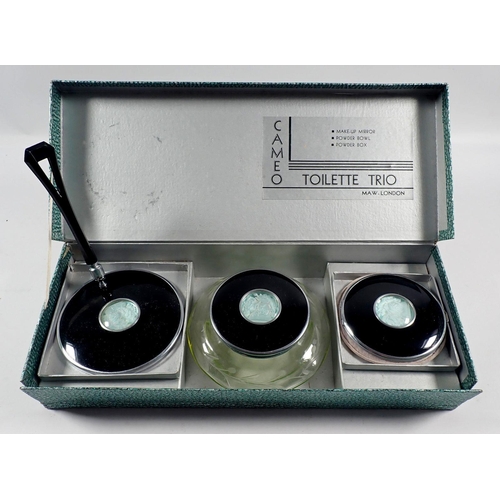 1062 - A Cameo 1930's toilette trio comprising compact, mirror and powder bowl, boxed and unused