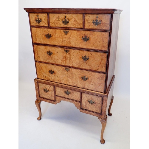 1065 - A mid-Georgian walnut chest on stand the crossbanded top with three short and three long drawers, th... 