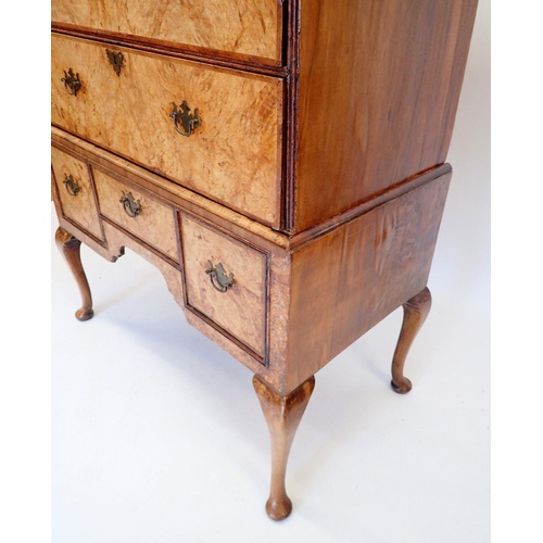 1065 - A mid-Georgian walnut chest on stand the crossbanded top with three short and three long drawers, th... 