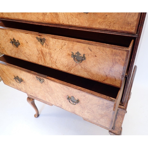 1065 - A mid-Georgian walnut chest on stand the crossbanded top with three short and three long drawers, th... 