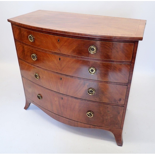 1077 - A large George III inlaid mahogany bow front chest of four long drawers with brass ring handles on s... 