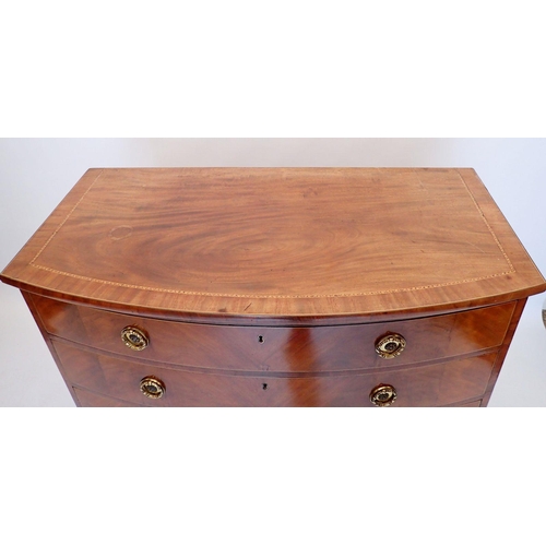 1077 - A large George III inlaid mahogany bow front chest of four long drawers with brass ring handles on s... 