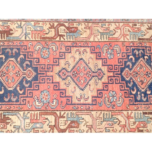 1087 - A Turkoman style runner with hooked  medallion design 293 x 76cm