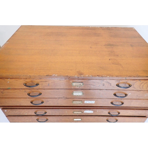 1088 - A large oak finish vintage plan chest with six drawers, 147cm wide