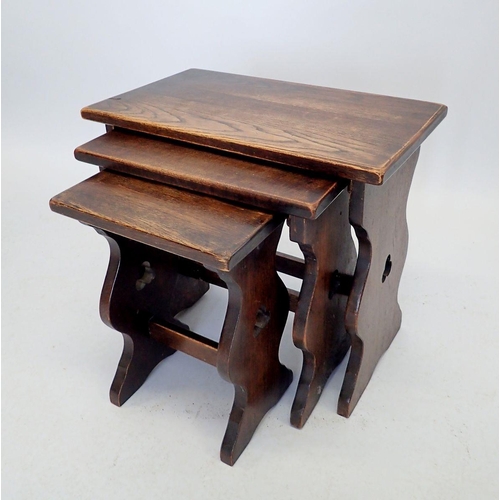 1091 - An oak small nest of occasional tables with pierced trefoil, 50 x 29cm