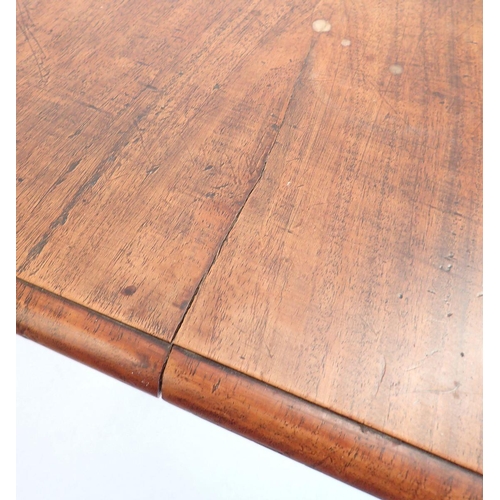 1092 - A Victorian mahogany wind-out dining table with two interleaves, all raised on baluster supports and... 