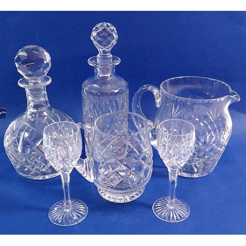 125 - A group of glass including Stuart crystal, two jugs, two decanters, multiple wine glasses, brandy, l... 