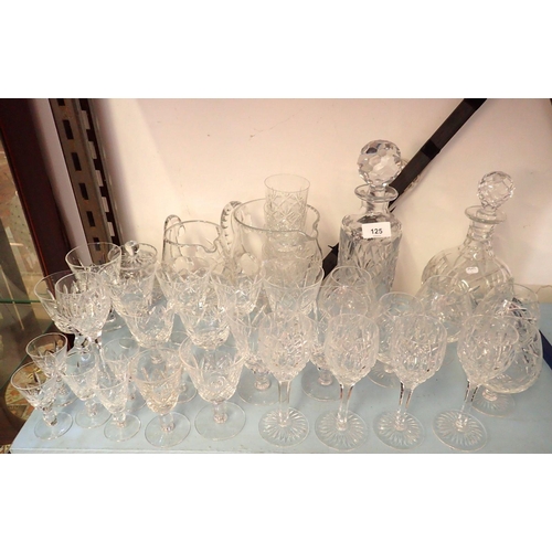 125 - A group of glass including Stuart crystal, two jugs, two decanters, multiple wine glasses, brandy, l... 