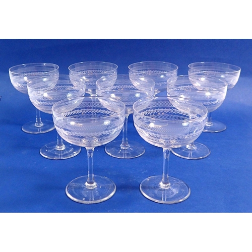 126 - A set of nine etched glass champagne bowls