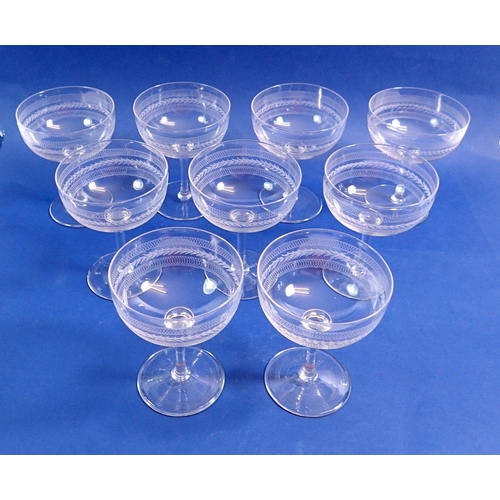 126 - A set of nine etched glass champagne bowls