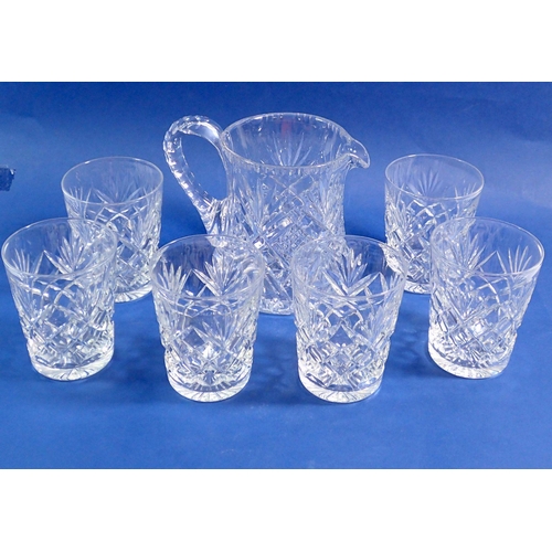 127 - A cut glass jug and six cut glass tumblers