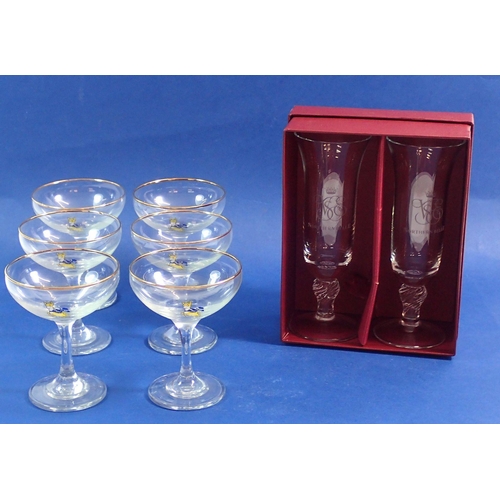 128 - A set of six Babycham glasses and two Northern Belle champagne glasses boxed