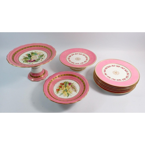 13 - An Edwardian pink dessert service painted border of roses comprising six plates and a comport plus t... 