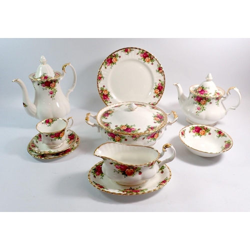 14 - A Royal Albert dinner and tea service comprising six dinner plates, six tea plates, six side plates,... 