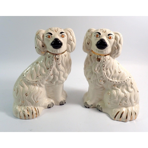 15 - A pair of Victorian Staffordshire dogs, 26cm