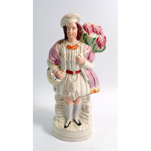 18 - A Victorian Staffordshire figure of a man with basket of flowers, 28cm tall