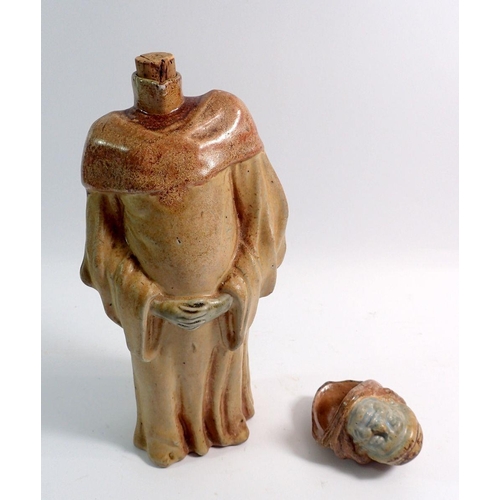 19 - A French pottery monk decanter, the lid formed as the head, 33cm high