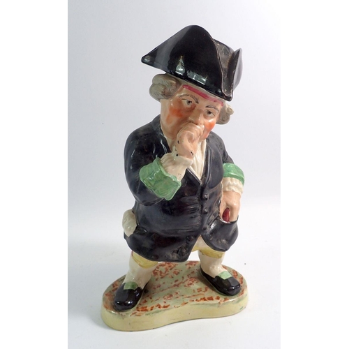 20 - A large Victorian Staffordshire Toby figure in the form of a man taking snuff with tricorn hat lid, ... 