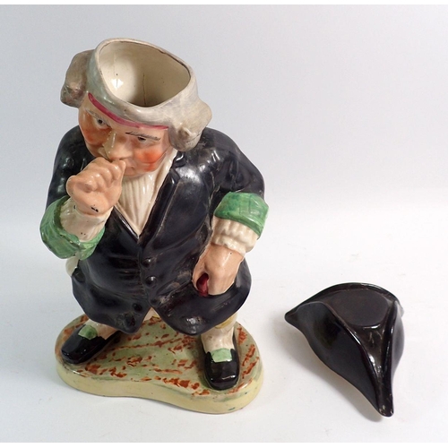 20 - A large Victorian Staffordshire Toby figure in the form of a man taking snuff with tricorn hat lid, ... 