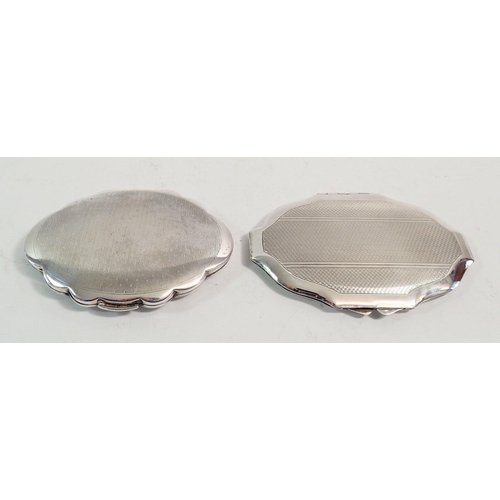 257 - A Kigu silver lobed compact, London 1966, 9cm and a sterling silver one, both with engine turned dec... 