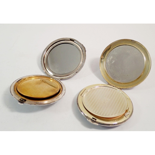 261 - Two silver circular compacts one with floral design, London 1959 by Kigu and an engine turned one wi... 