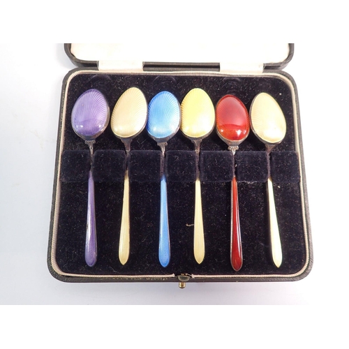 267 - A matched set of six harlequin enamel teaspoons, boxed, circa 1920's