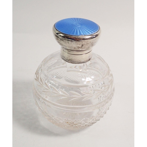 271 - A cut glass scent bottle with blue enamel hinged lid, with inner stoppper, 11cm tall