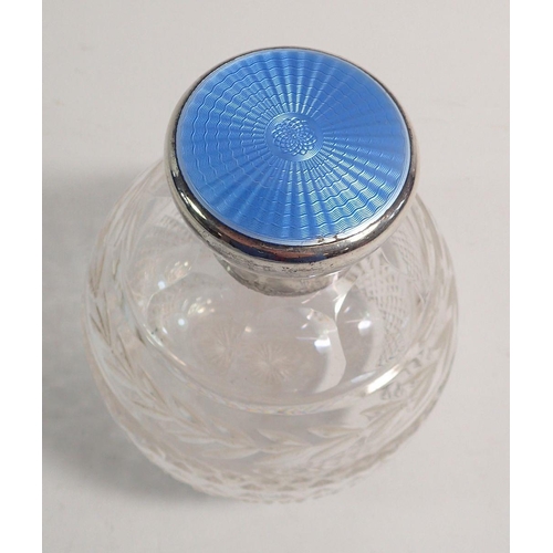 271 - A cut glass scent bottle with blue enamel hinged lid, with inner stoppper, 11cm tall