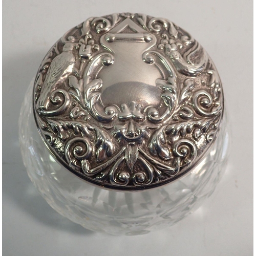 272 - A silver and cut glass powder bowl with mirror to inner lid, embossed bird decoration, Birmingham 19... 