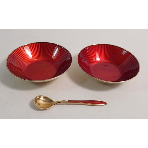 276 - A pair of Norwegian David Andersen silver gilt and red enamel circular salts and one spoon