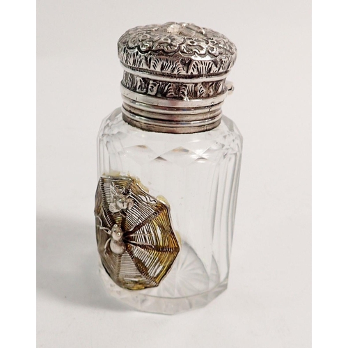 279 - A Victorian cut glass scent bottle with white metal applied spider and hinged embossed lid, 7cm tall