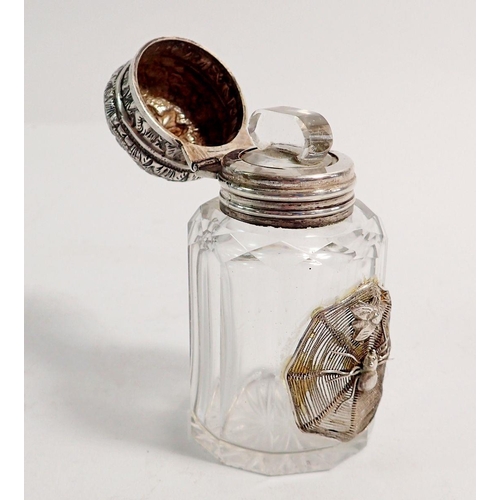 279 - A Victorian cut glass scent bottle with white metal applied spider and hinged embossed lid, 7cm tall